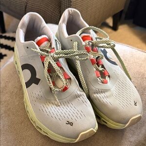 On Running Sneakers in Light Gray with Red and Black Details